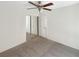 Bedroom featuring a ceiling fan, carpet floors, and mirrored closet doors at 7873 Running Doe Ct, Las Vegas, NV 89149
