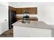 Well-equipped kitchen with stainless steel appliances, ample cabinet space, modern countertops, and a kitchen island at 7873 Running Doe Ct, Las Vegas, NV 89149