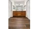 Bathroom featuring wood-look floors, double sink vanity, and a large mirror for a bright and open feel at 7873 Running Doe Ct, Las Vegas, NV 89149