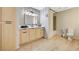Bright bathroom featuring a wood vanity with black hardware and a toilet at 8000 Badura Ave # 1007, Las Vegas, NV 89113