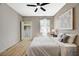 Bright bedroom with ceiling fan, closet, and natural light from a window at 8000 Badura Ave # 1007, Las Vegas, NV 89113
