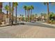View of the gate and entrance for the community with tropical landscaping at 8000 Badura Ave # 1007, Las Vegas, NV 89113