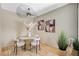 Chic dining area featuring a round table, stylish chairs, and decorative artwork at 8000 Badura Ave # 1007, Las Vegas, NV 89113