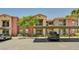 Apartment building with mature landscaping, covered parking, and convenient access to units on multiple levels at 8000 Badura Ave # 1007, Las Vegas, NV 89113