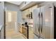 Bright kitchen featuring stainless steel appliances and adjacent laundry room at 8000 Badura Ave # 1007, Las Vegas, NV 89113