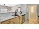 Bright kitchen featuring light wood cabinets, stainless steel appliances, and marble countertops at 8000 Badura Ave # 1007, Las Vegas, NV 89113