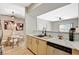 Bright kitchen featuring stone countertops, stainless steel appliances, a sleek black faucet, and modern light fixtures at 8000 Badura Ave # 1007, Las Vegas, NV 89113