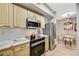 Modern kitchen featuring stainless steel appliances, light wood cabinets, and white marble countertops at 8000 Badura Ave # 1007, Las Vegas, NV 89113