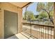 Outdoor patio overlooking trees and landscaping, offering fresh air and privacy at 8000 Badura Ave # 1007, Las Vegas, NV 89113