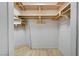 Spacious walk-in closet with custom wood shelving, and a full length mirror at 8000 Badura Ave # 1007, Las Vegas, NV 89113