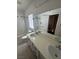 Bathroom with tub-shower combo and a double sink vanity with modern fixtures at 8215 Shell Beach Ct, Las Vegas, NV 89117