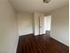Bedroom featuring hardwood flooring and white walls at 8215 Shell Beach Ct, Las Vegas, NV 89117