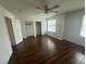 Spacious bedroom with hardwood flooring, ceiling fan, closet and natural light at 8215 Shell Beach Ct, Las Vegas, NV 89117