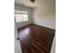 Bedroom with hardwood flooring and a bright window at 8215 Shell Beach Ct, Las Vegas, NV 89117