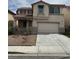 Charming two-story home with a spacious two car garage and low maintenance front yard at 8215 Shell Beach Ct, Las Vegas, NV 89117