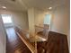 Upstairs hallway with hardwood floors and white walls at 8215 Shell Beach Ct, Las Vegas, NV 89117