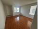Inviting living room featuring hardwood floors and natural light from a large window at 8215 Shell Beach Ct, Las Vegas, NV 89117