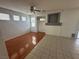 Spacious living area with a ceiling fan, tile floors, and a decorative fireplace at 8215 Shell Beach Ct, Las Vegas, NV 89117