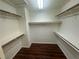 Spacious walk-in closet with wood-like floors and shelving on all sides at 8215 Shell Beach Ct, Las Vegas, NV 89117