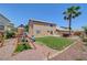 A spacious backyard features a play structure, spa, and lush landscaping, perfect for outdoor enjoyment at 8333 Valley Stream Ave, Las Vegas, NV 89131