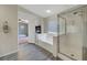 Light and bright bathroom with a shower, soaking tub, and luxury vinyl plank flooring at 8333 Valley Stream Ave, Las Vegas, NV 89131