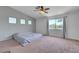 Spacious primary bedroom with large windows offering neighborhood views at 8333 Valley Stream Ave, Las Vegas, NV 89131