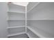 A large walk-in closet with white walls and shelving to maximize storage at 8333 Valley Stream Ave, Las Vegas, NV 89131