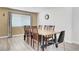 Dining room featuring a wood table set with seating for six and a large window at 8333 Valley Stream Ave, Las Vegas, NV 89131