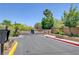 A gated community entrance with mature landscaping, providing security and curb appeal at 8333 Valley Stream Ave, Las Vegas, NV 89131