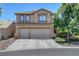 Charming two-story home featuring a three-car garage, desert landscaping, and a welcoming facade at 8333 Valley Stream Ave, Las Vegas, NV 89131