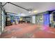 Spacious garage with shelving, storage, and lighting, offering ample room for vehicles and projects at 8333 Valley Stream Ave, Las Vegas, NV 89131