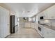 Spacious kitchen with white cabinets, stainless steel appliances, and an open floor plan at 8333 Valley Stream Ave, Las Vegas, NV 89131