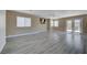 Bright living room featuring neutral walls, a ceiling fan, and access to the backyard at 8333 Valley Stream Ave, Las Vegas, NV 89131