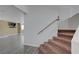 Carpeted staircase leading to the living area with wood-look flooring at 8333 Valley Stream Ave, Las Vegas, NV 89131