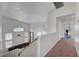 Upstairs hallway overlooking the living area, creating an open feel at 8333 Valley Stream Ave, Las Vegas, NV 89131