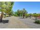 Scenic community walking path with mature trees, landscaping, and manicured grounds at 8333 Valley Stream Ave, Las Vegas, NV 89131