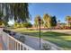Scenic community walking path with mature trees, landscaping, and manicured grounds at 8333 Valley Stream Ave, Las Vegas, NV 89131