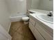 Clean bathroom with tiled floors, bathtub, and vanity with sink at 8940 Antioch Way, Las Vegas, NV 89117