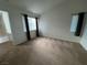 This bedroom features ample natural light from two windows and neutral carpeting, offering a serene retreat at 8940 Antioch Way, Las Vegas, NV 89117