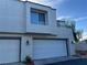 Inviting two-story home featuring a two-car garage and modern architectural details at 8940 Antioch Way, Las Vegas, NV 89117