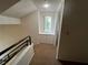 Hallway featuring a bright window and built-in storage, enhanced by neutral paint and carpeting at 8940 Antioch Way, Las Vegas, NV 89117
