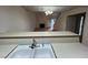 Kitchen sink view into living room, showing open layout and natural light at 8940 Antioch Way, Las Vegas, NV 89117