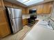 Kitchen featuring stainless steel appliances and wood cabinets at 8940 Antioch Way, Las Vegas, NV 89117