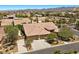 Expansive aerial view of a beautiful property with a circular driveway and a well-manicured lawn at 9270 Valerie Elaine St, Las Vegas, NV 89139