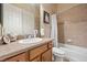 Bathroom featuring tiled shower, fresh vanity, and modern fixtures at 9270 Valerie Elaine St, Las Vegas, NV 89139