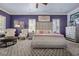 Spacious bedroom featuring stylish decor, plantation shutters, and comfortable seating at 9270 Valerie Elaine St, Las Vegas, NV 89139