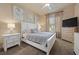 Inviting bedroom with neutral tones, a ceiling fan, and ample storage at 9270 Valerie Elaine St, Las Vegas, NV 89139