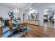 Elegant dining room features wood floors, modern chandelier, and stylish decor at 9270 Valerie Elaine St, Las Vegas, NV 89139