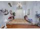 Grand foyer with a chandelier, high ceilings, and a decorative tile inlay at the entrance at 9270 Valerie Elaine St, Las Vegas, NV 89139