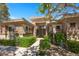 Charming front of home boasting stone accents, manicured greenery, and decorative wrought iron details above windows at 9270 Valerie Elaine St, Las Vegas, NV 89139